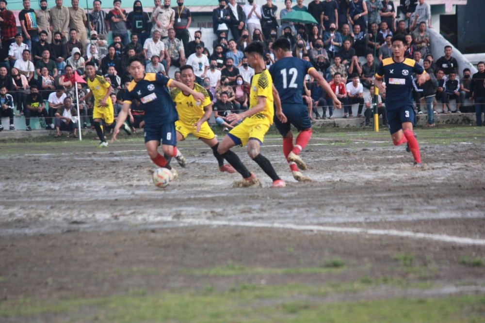 Kohima (blue) and Mokokchung (yellow) in action on the second day of the Inter-District Football Championship 2022 at Imkongmeren Sports Complex Mokokchung on April 19. (Morung Photo)